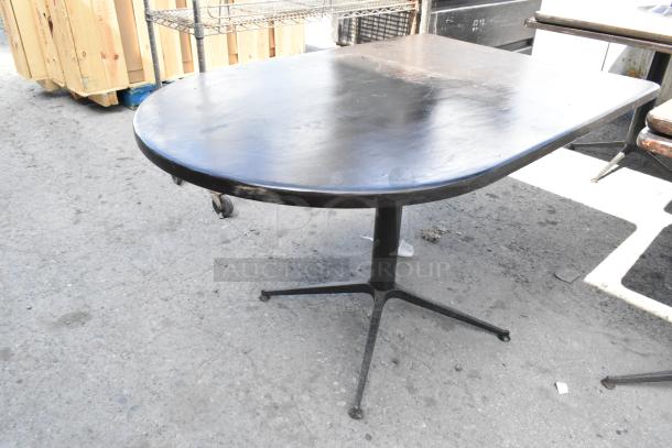 3 dining height tables in varying styles on auction. Key features: dark wood tops, metal bases. Moderate wear.