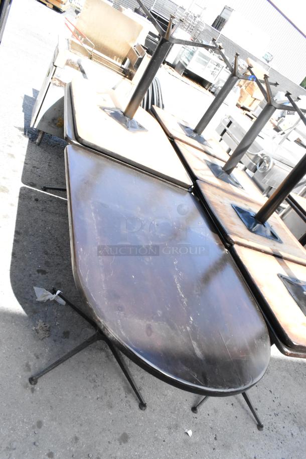 Set of 3 dining height tables, various sizes. Dark wood tops with metal legs, in used condition. Auction includes 3 tables.