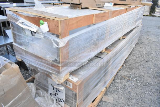 9 brand new scratch and dent items wrapped on a pallet, includes shelves, legs, and patio umbrellas. Auction lot.