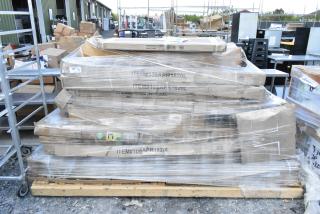 Pallet with 18 boxed new items, including a white cabinet, outdoor table, and barstool frame, wrapped in plastic.
