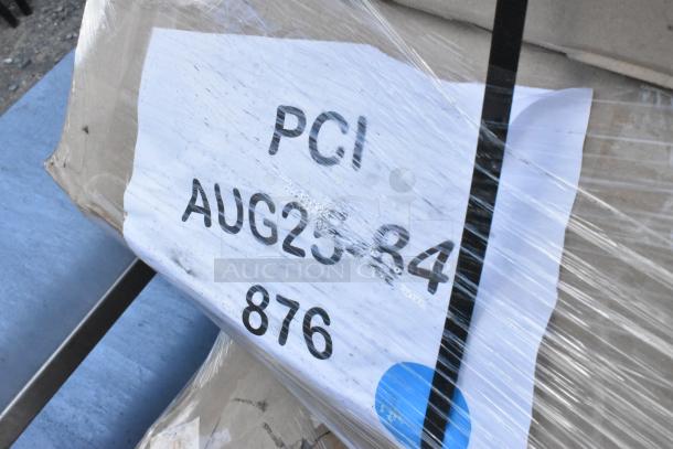 Bundle of 18 scratch and dent items, wrapped, including a white cabinet, outdoor table, and barstool frame. Label reads "PCI AUG25-84 876".