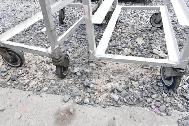 2 metal commercial pan transport racks on casters, one caster missing, used condition, double your bid offer.