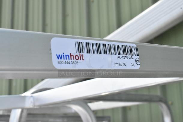 Winholt metal pan transport rack on commercial casters, model AL-1210-WM. Features NSF certification label.