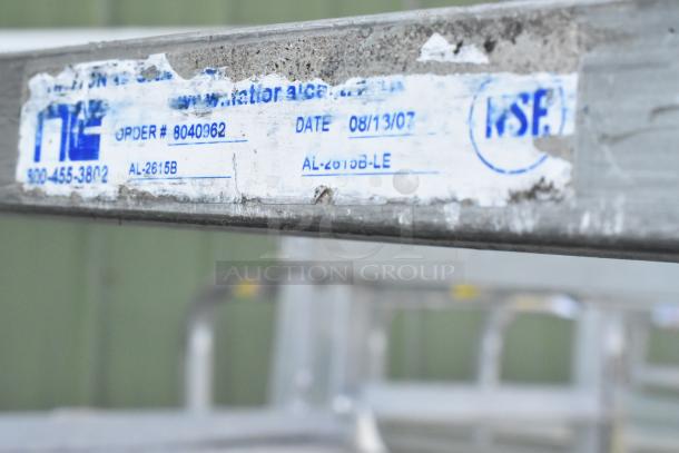 2 Metal commercial pan transport racks on commercial casters, showing manufacturer's label with order number 8040962.