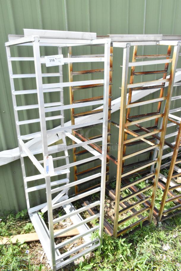 2 metal commercial pan transport racks with casters and oven guide, in used condition. Includes visible labels.