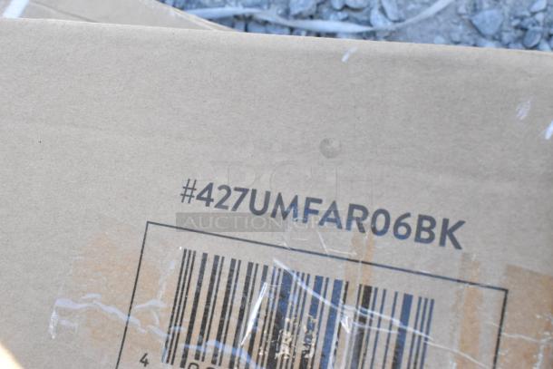 Cardboard box with the label "#427UMFAR06BK" and a partially visible barcode, indicating batch details for auctioned items.
