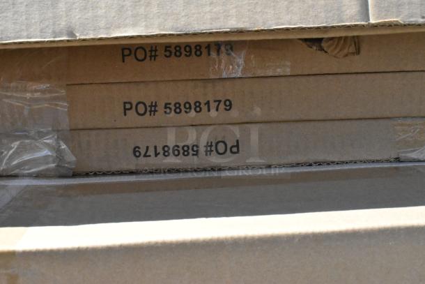 Stacked cardboard boxes labeled with PO# 5898179. Items include over shelf, wire shelves, patio umbrella frames. Scratch and dent condition.