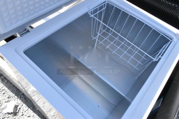 Open mini chest freezer with wire basket, part of a lot including Frigidaire, Criterion, Galanz, and Midea models.