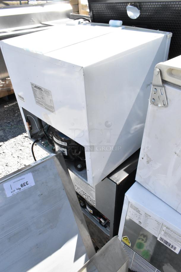 8 mini coolers including Galanz GL27BK, Hisense RR17D6ABE, in used condition. Model labels and Cyclopentane marking visible.