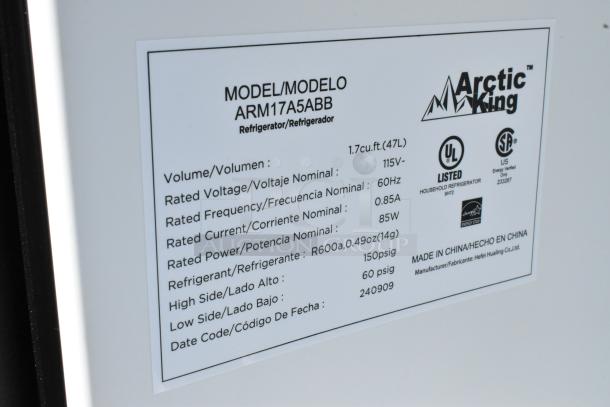 Label on Arctic King ARM17A5ABB mini cooler showing model, volume 1.7 cu.ft, voltage 115V, UL listed, made in China.