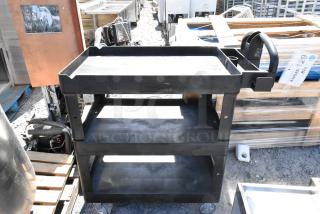 BRAND NEW SCRATCH AND DENT Rubbermaid Brute black poly 3-tier cart with commercial casters; durable, minor imperfections.