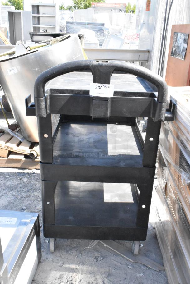 BRAND NEW Rubbermaid Brute Black Poly 3 Tier Cart with commercial casters, slight scratches, durable construction.