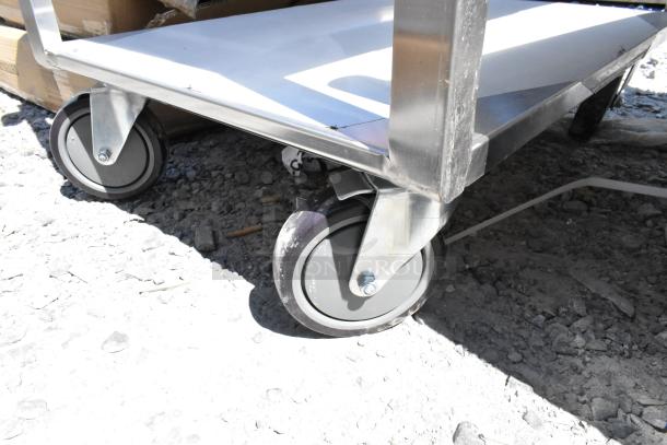 Regency 600CT1931WD stainless steel 3-tier cart, new scratch and dent, on commercial casters, durable and functional.