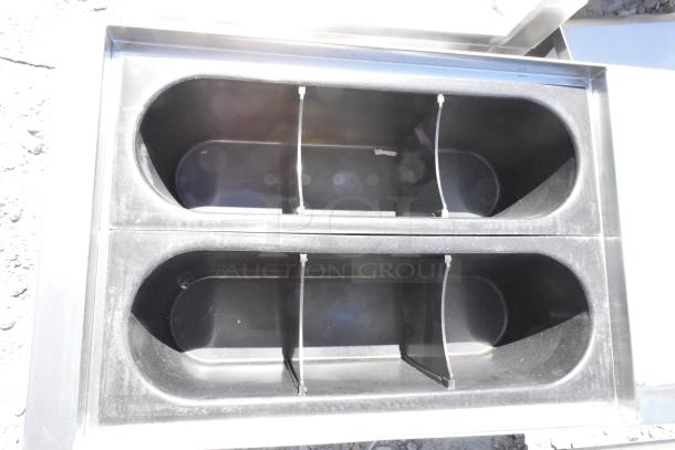 Brand new Regency 600IB2412S 24"x12" underbar ice bin, 35 lb capacity, no legs, visible scratch and dent marks.