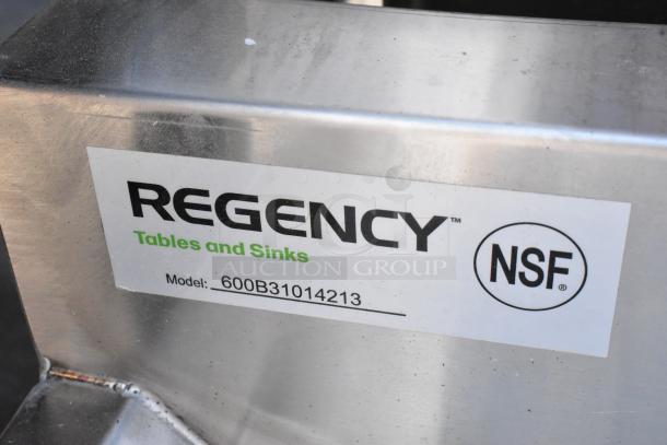 Regency stainless steel 3-bay bar sink, model 600B31014213, brand new with minor scratches and dents. Features dual drain boards.