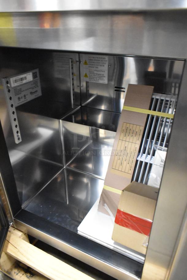 Brand new Blue Air BLUR48-HC stainless steel commercial 2-door cooler. Scratch and dent, 115 volts, 1 phase. Interior view.