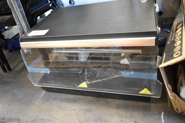 Avantco 177OAM1A metal commercial countertop heated open air merchandiser, 120 volts, 1 phase. Visible wear and taped panels.