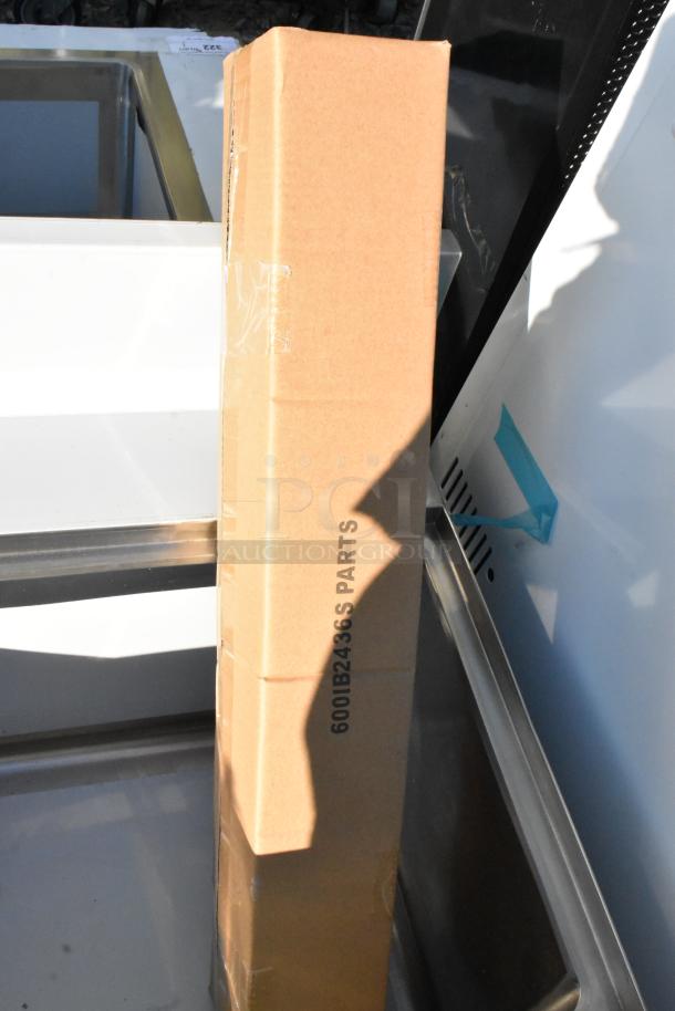 BRAND NEW Regency 600IB2436S Spec Line 24" x 36" underbar ice bin, 119 lb capacity, visible box labeled "600IB2436S PARTS".