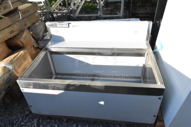 Brand new Regency 600IB2436S Spec Line 24" x 36" underbar ice bin, 119 lb capacity, visible scratch and dent, labels intact.
