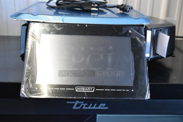 BRAND NEW 2024 Hobart HTi Metal Commercial Food Scale, in box. Features a digital display. 120/208-240 Volts, 1 Phase.