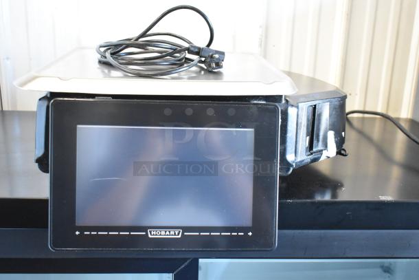 Brand new 2017 Hobart HTi metal food portioning scale, commercial countertop model. Features digital display, 120/208-240V, 1 phase.