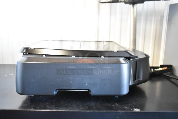 Brand new Hobart HTi 2025 metal commercial scale in box, countertop design, 120/208-240V, 1 phase, ideal for food portioning.