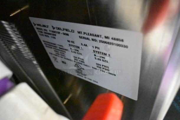 Label on Delfield F18DC72P-DOM stainless steel prep table showing specs: 115V, 1 phase, R-290 refrigerant, made in USA.