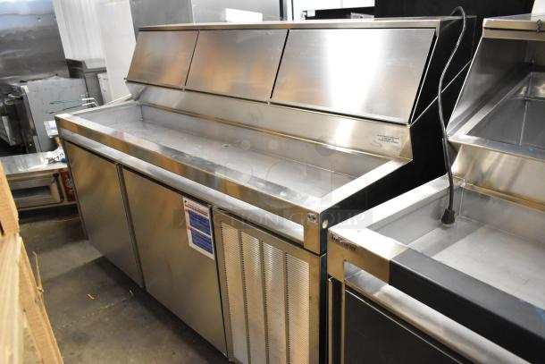 Brand new Delfield F18DC72P-DOM stainless steel prep table, commercial casters, 115V, tested, minor cosmetic imperfections.
