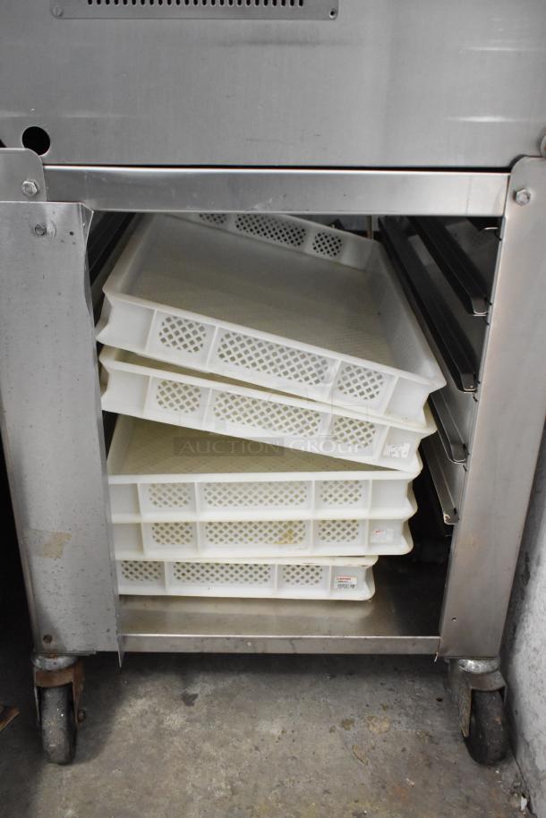 Italgi P35A pasta extruder, stainless steel, 220V, shown with open storage compartment containing stacked trays.