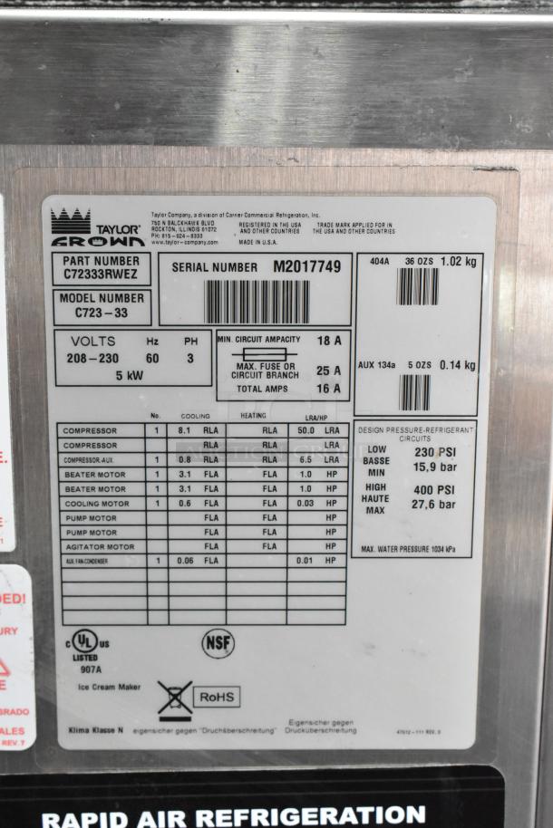 Taylor C723-33 Stainless Steel Water Cooled 2 Flavor Soft Serve Ice Cream Machine label, 208-230V, 3 Phase, on casters.