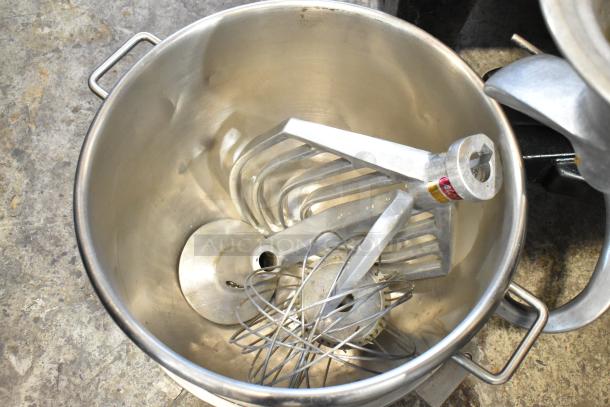 Hobart L-800 80-quart mixer with bowl, dough hooks, paddle, and whisk attachments. Metal finish, commercial-grade condition.