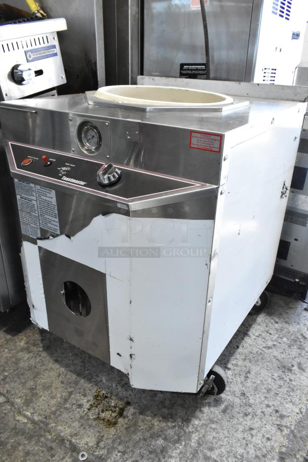 Toastmaster TCT-1627 R stainless steel tandoor oven, natural gas, 85,500 BTU, on casters. Used condition with visible wear.