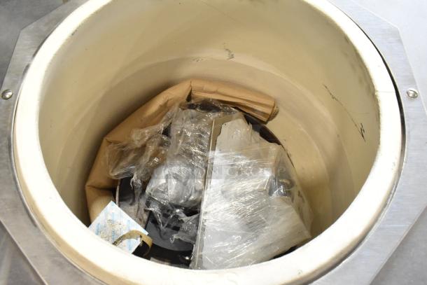 Toastmaster TCT-1627 R stainless steel tandoor oven interior. Includes original packaging materials. 85,500 BTU capacity.
