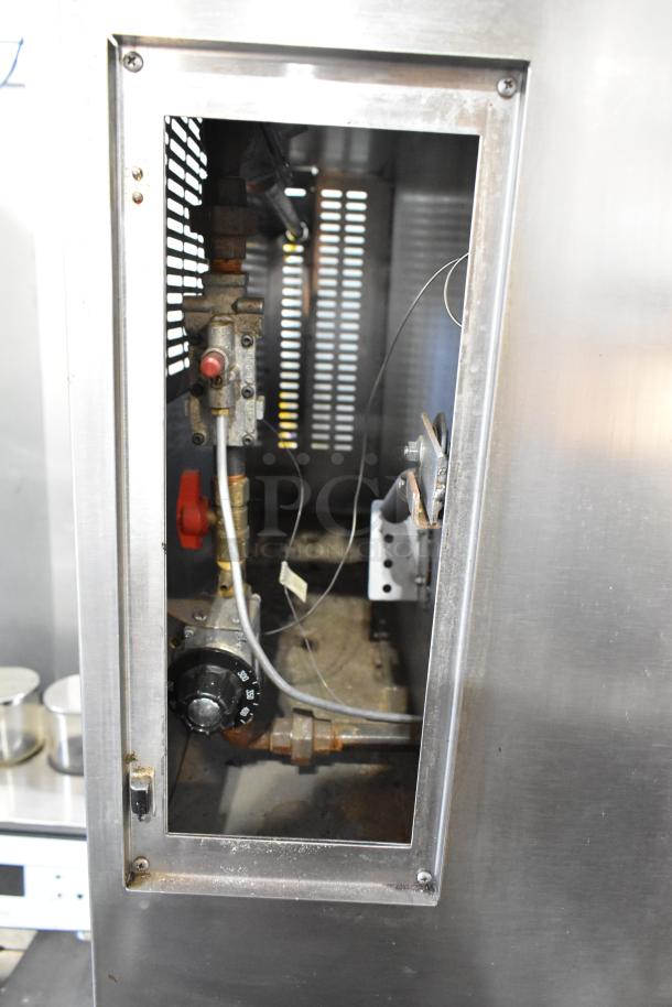 Marsal & Sons SD 660 pizza oven interior showing mechanical components, visible wear, stainless steel exterior.