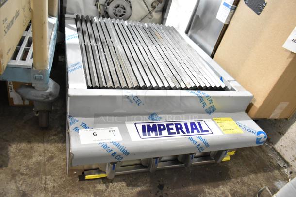 Imperial IRB-24 stainless steel 24" countertop charbroiler, new scratch and dent, with radiant burners and label visible.