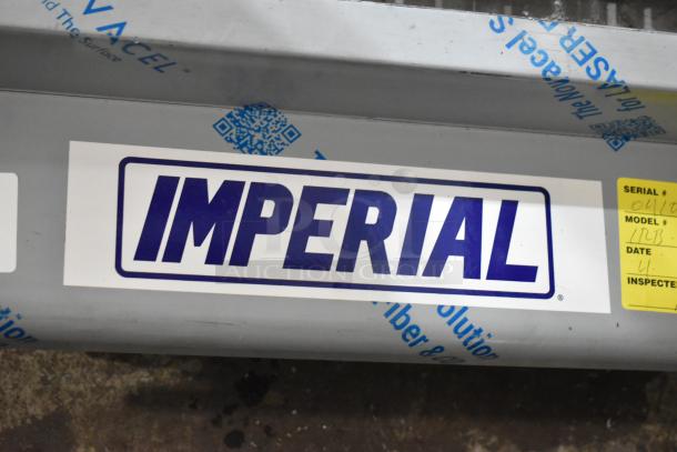 Brand new Imperial IRB-24 24" stainless steel propane charbroiler, scratch and dent condition, model label visible.