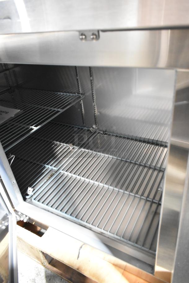 BRAND NEW Avantco 178SSPPT3 stainless steel commercial pizza prep table, 2025 model. Scratch and dent. Commercial casters.