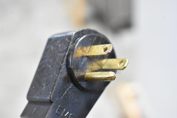 Close-up of the three-prong plug for the Polar Temp 300 CWGP ice merchandiser, 115 volts, showing slight scratches.