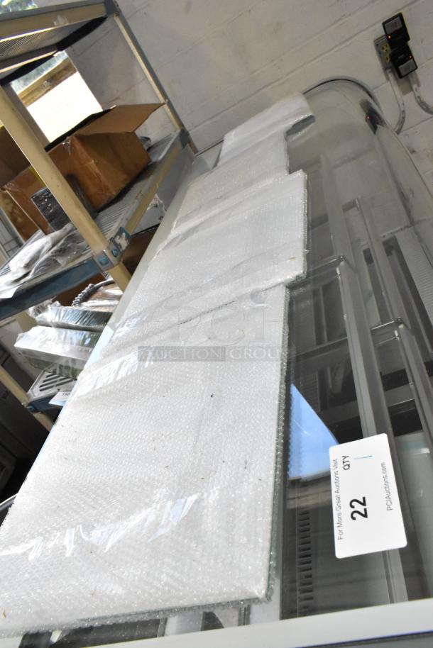 Brand new Avantco 193BC72HCW 72" curved glass refrigerated bakery display case. Note: side glass damage visible.