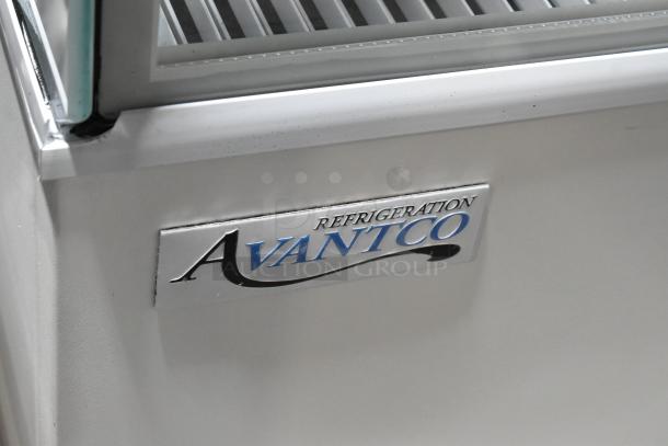 Avantco 193BC72HCW refrigerated bakery display case with curved glass, white finish. Side glass damage visible. 115V, 1 phase.