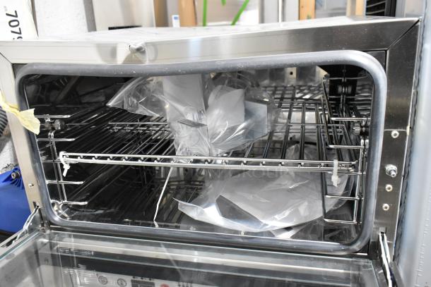 Brand new Cooking Performance Group COH-D3-A electric convection oven, 3 trays, half size, with moisture injection, minor dents.