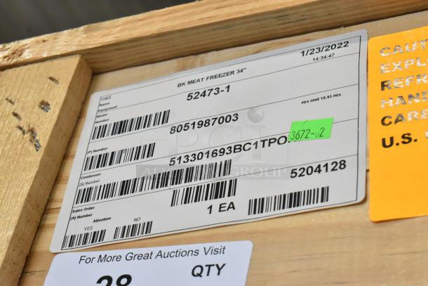 Alt text: "Label on crate for brand new 2022 BKI 52473-1 stainless steel commercial fry freezer with fry basket holder."