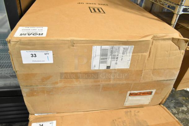 New Roam MTC 6003 IESHK2 Power Input Box in original packaging with visible scratches and dents. Labels show shipping info.