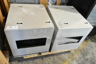Two metal boxes with cutouts, auction lot 37 tag visible, used condition, suitable for storage or industrial use.