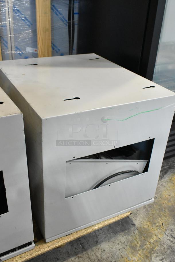 Two metal boxes with side slots, visible scratches, and industrial design; offered as "2 Times Your Bid."