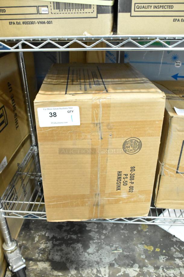 Cardboard box containing a brand new Advance Tabco 7-PS-66 stainless steel single bay wall mount sink, labeled as scratch and dent condition.