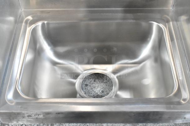 Alt text: Advance Tabco 7-PS-66 single bay wall mount sink, stainless steel, new with light scratches and dents.