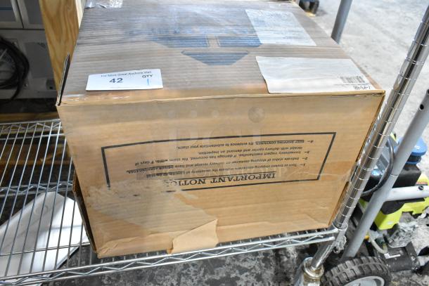 Boxed Advance Tabco 7-PS-66 stainless steel wall mount sink, new with minor packaging damage, item tag indicating auction details.