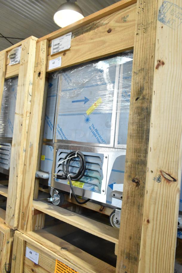 Brand new H&K 52473-1 stainless steel French fry freezer in crate, with fry basket holder, on commercial casters. 115V, 1 phase.