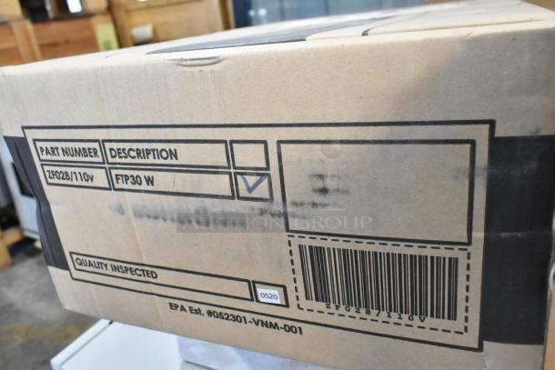 Two brand new FTP30 W insect light traps in box, labeled with part number ZF028/110V, quality inspected, with barcode.